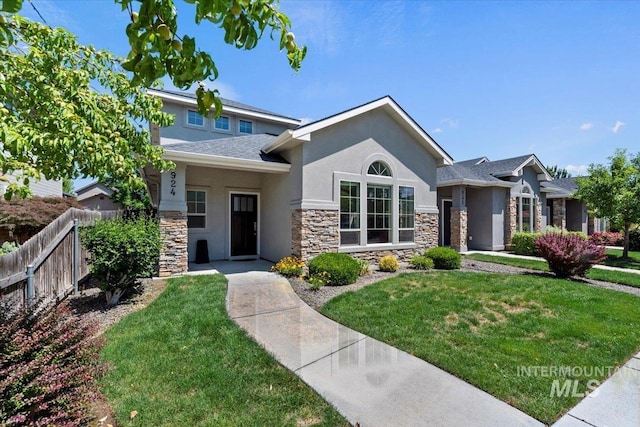 924 E Wright St, Boise, ID 83706 - view of front of home featuring stone siding, stucco siding, and roof with shingles