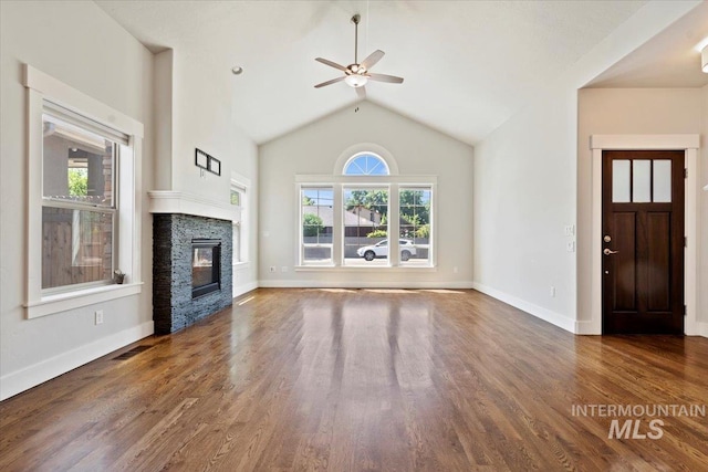 924 E Wright St, Boise, ID 83706 - unfurnished living room with a ceiling fan, wood finished floors, a fireplace, and lofted ceiling