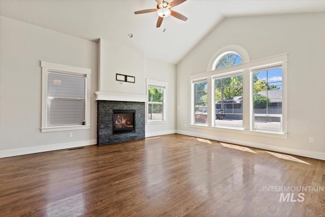 924 E Wright St, Boise, ID 83706 - unfurnished living room featuring a ceiling fan, a fireplace, wood finished floors, and high vaulted ceiling