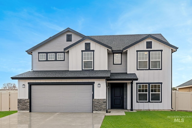 339 W Omphale St, Kuna, ID 83634 - view of front of property with driveway, a shingled roof, an attached garage, stone siding, and board and batten siding