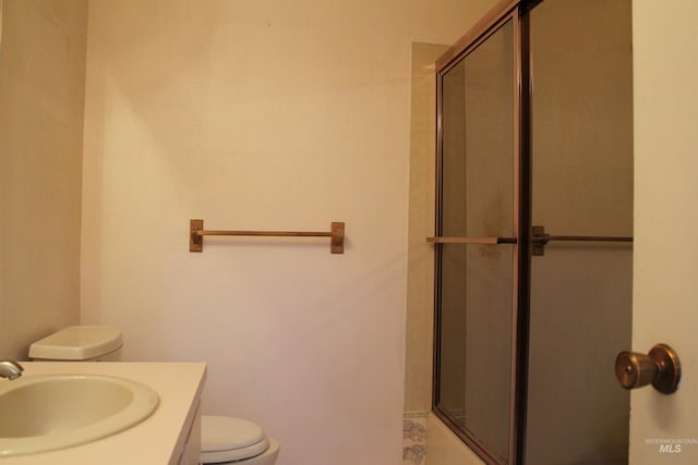 6244 Coach Royale Ln, Boise, ID 83704 - bathroom with toilet, a shower with shower door, and vanity
