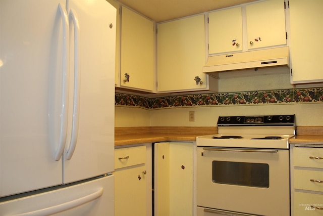 6244 Coach Royale Ln, Boise, ID 83704 - kitchen featuring white appliances, under cabinet range hood, light countertops, and white cabinets