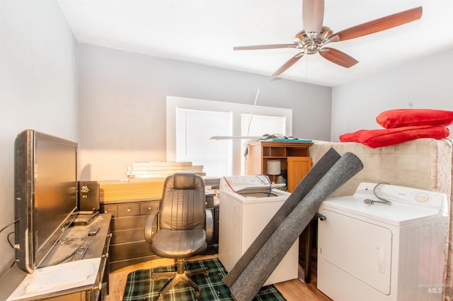 washroom featuring a ceiling fan, washer / clothes dryer, light wood finished floors, and laundry area