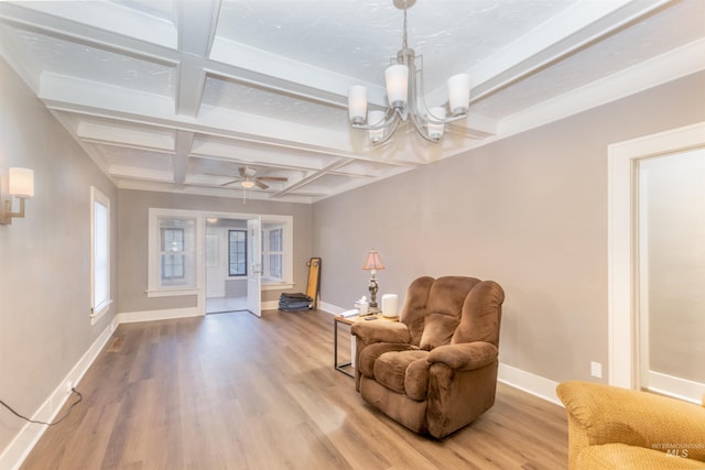 sitting room featuring beamed ceiling, coffered ceiling, wood finished floors, and baseboards