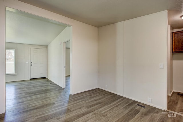 unfurnished room featuring wood-type flooring