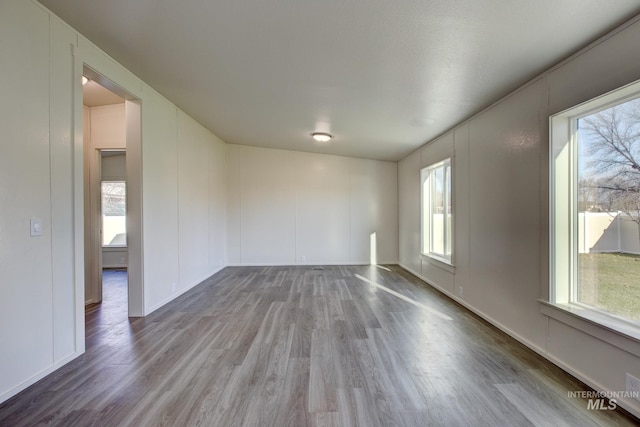 spare room featuring light hardwood / wood-style flooring