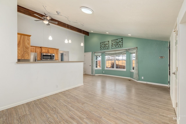 unfurnished living room featuring ceiling fan, high vaulted ceiling, beamed ceiling, and light hardwood / wood-style flooring