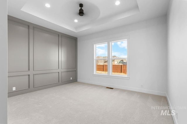 2716 N Heirloom Ave, Eagle, ID 83616 - spare room featuring a raised ceiling and light colored carpet