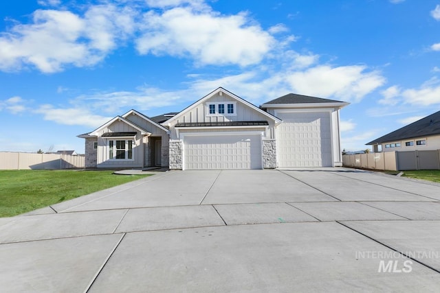 2716 N Heirloom Ave, Eagle, ID 83616 - view of front of house with a front lawn, fence, a garage, and concrete driveway