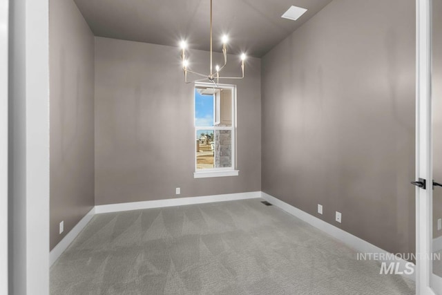 2716 N Heirloom Ave, Eagle, ID 83616 - unfurnished dining area featuring carpet, a chandelier, and baseboards