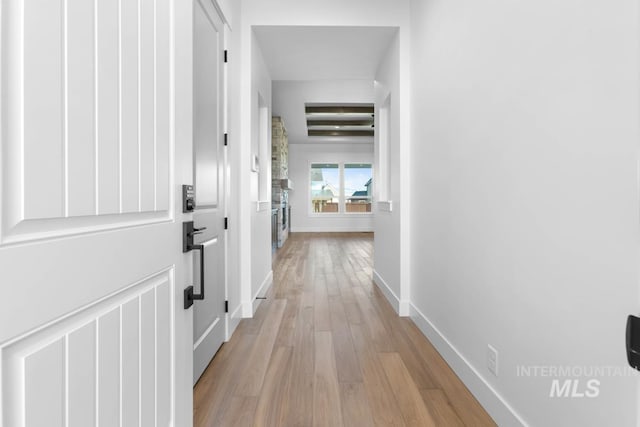 2716 N Heirloom Ave, Eagle, ID 83616 - corridor featuring baseboards and light wood-style floors