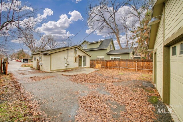 back of property with a patio