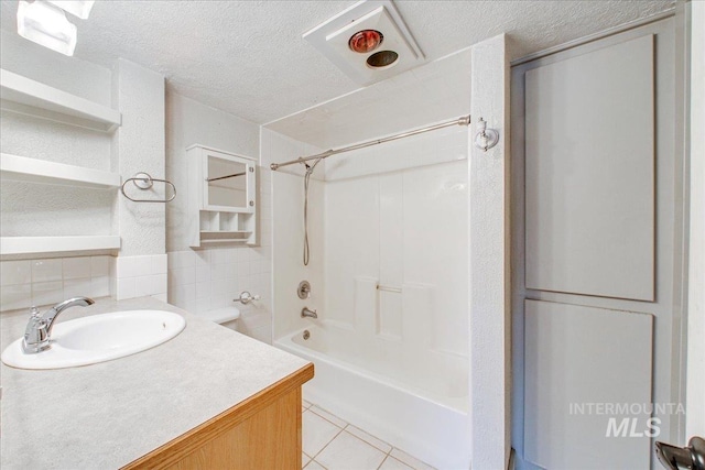 bathroom featuring decorative backsplash, vanity, a textured ceiling, shower / washtub combination, and tile patterned flooring