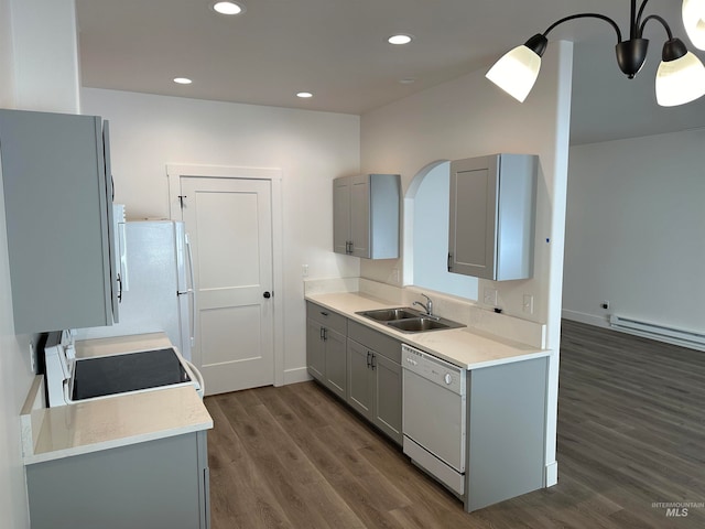 kitchen featuring light countertops, white appliances, and gray cabinets