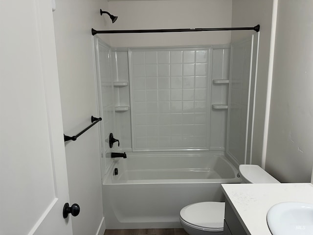 full bath featuring tub / shower combination, vanity, and toilet