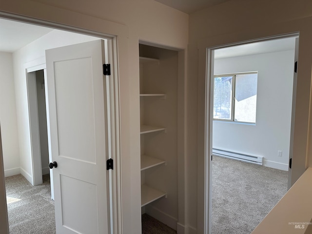 closet featuring baseboard heating