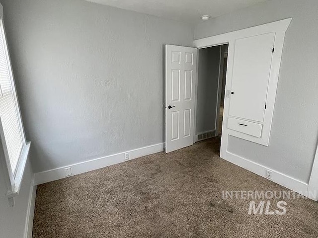 unfurnished bedroom with carpet