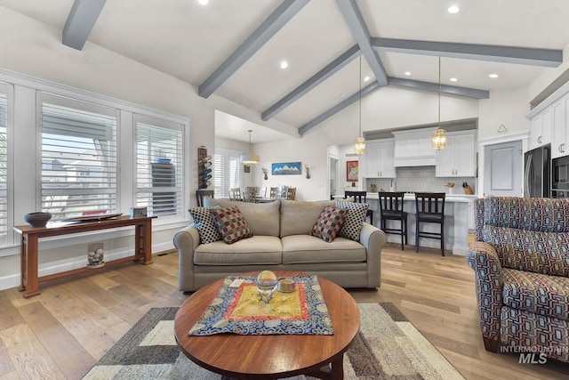 living room featuring high vaulted ceiling, beam ceiling, light wood-style flooring, and recessed lighting