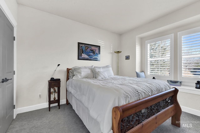 bedroom with carpet floors and baseboards