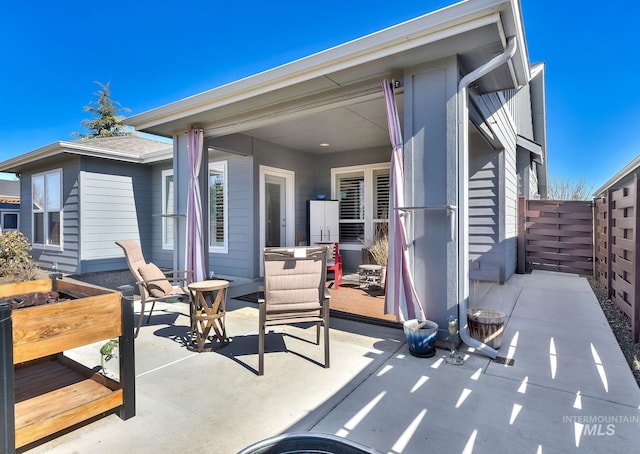 view of patio / terrace featuring fence