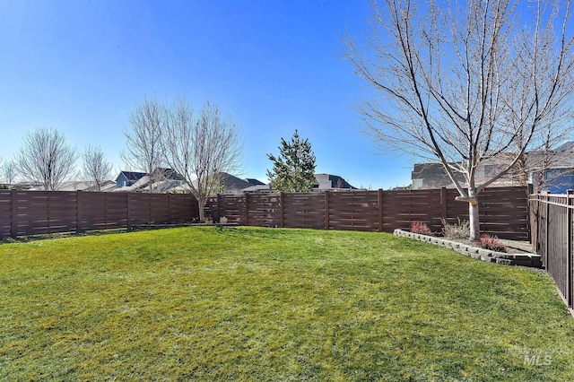 view of yard featuring a fenced backyard