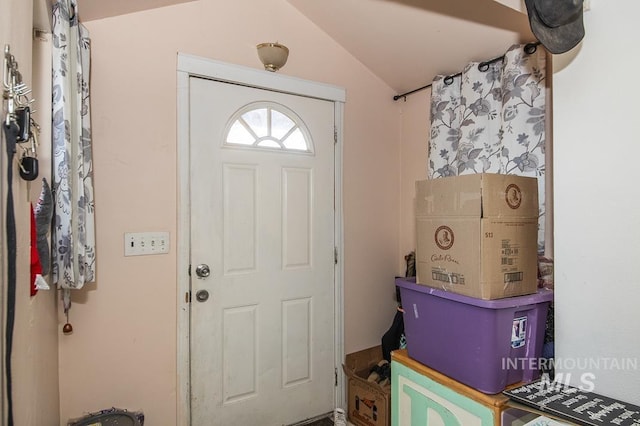 entrance foyer featuring lofted ceiling