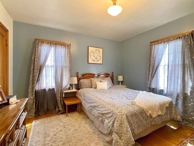 bedroom featuring wood finished floors