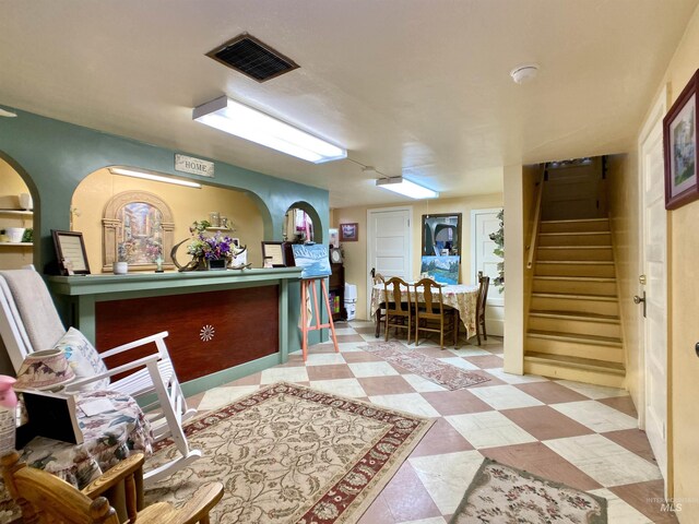 reception area featuring stairs and visible vents