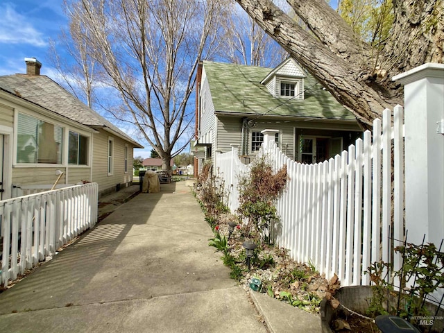 view of side of home with fence