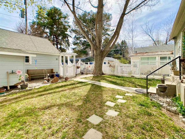 view of yard with fence and a gate