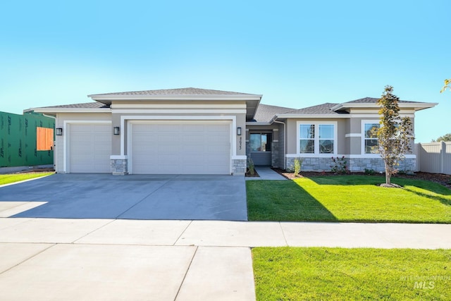 17639 N El Dorado Ave, Nampa, ID 83687 - prairie-style home with a garage, stone siding, concrete driveway, and stucco siding