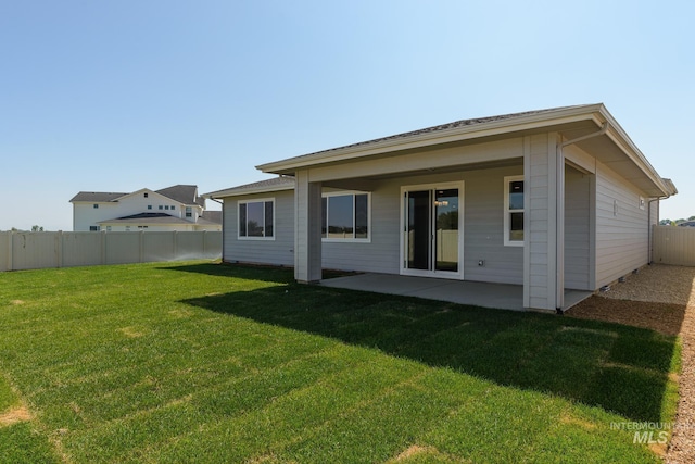 17639 N El Dorado Ave, Nampa, ID 83687 - back of property featuring a patio and a fenced backyard