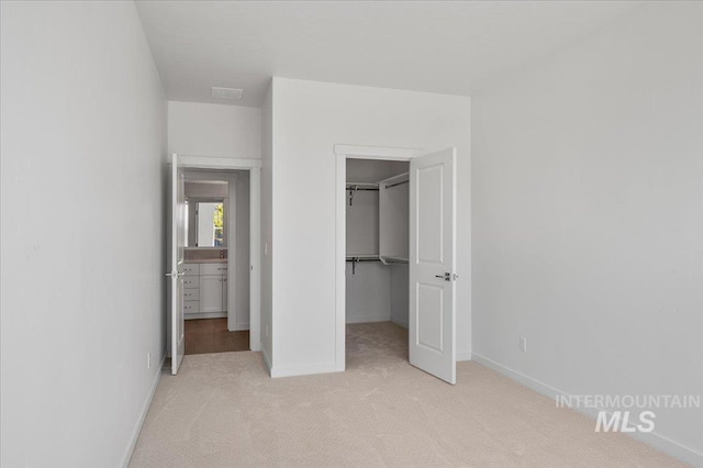 17639 N El Dorado Ave, Nampa, ID 83687 - unfurnished bedroom with light carpet, a spacious closet, and a closet