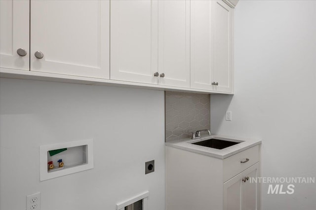 17639 N El Dorado Ave, Nampa, ID 83687 - laundry area featuring cabinet space, electric dryer hookup, and washer hookup