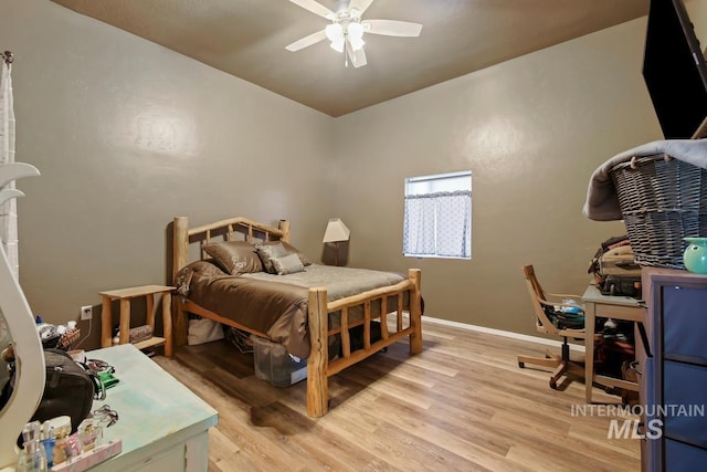 bedroom with light hardwood / wood-style flooring and ceiling fan