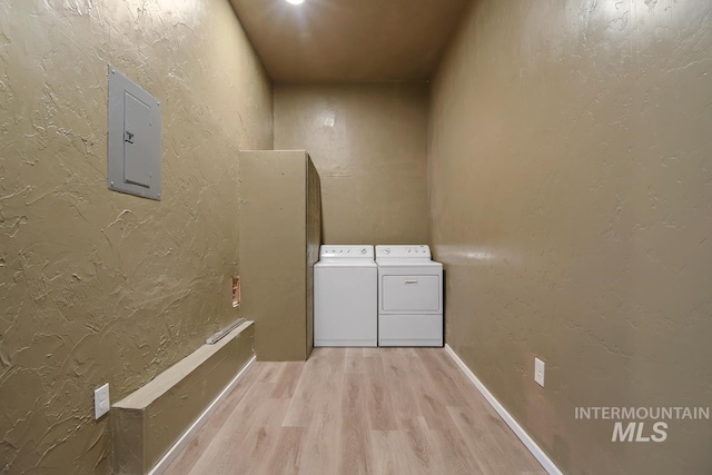 washroom featuring light hardwood / wood-style flooring and washer and clothes dryer