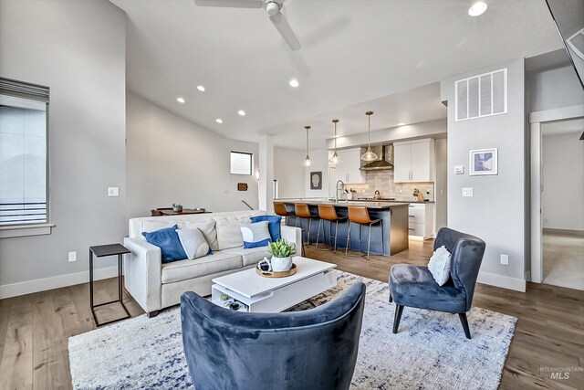 6420 W Glencrest Ln, Boise, ID 83714 - living area featuring recessed lighting, visible vents, dark wood-style flooring, baseboards, and ceiling fan