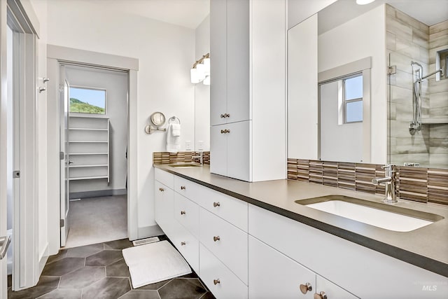 6420 W Glencrest Ln, Boise, ID 83714 - full bathroom with baseboards, double vanity, tiled shower, and a sink