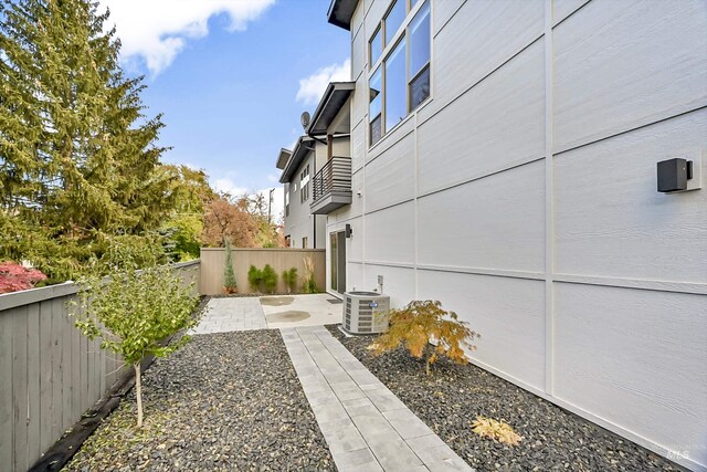 6420 W Glencrest Ln, Boise, ID 83714 - view of yard featuring fence, a balcony, and central AC