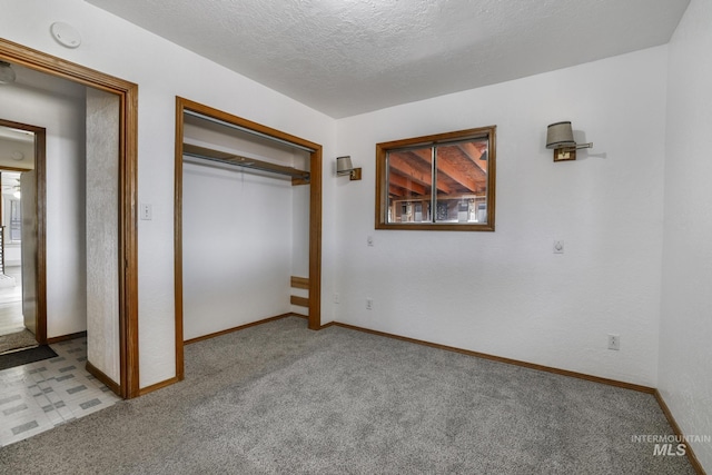 561 3rd Ave N, Twin Falls, ID 83301 - unfurnished bedroom with carpet flooring, baseboards, a closet, and a textured ceiling