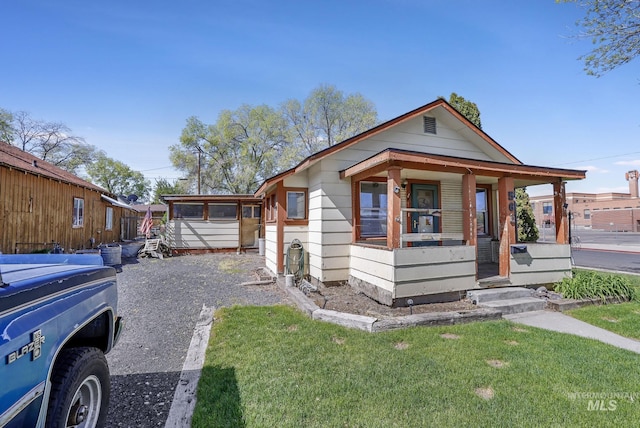 561 3rd Ave N, Twin Falls, ID 83301 - view of front facade featuring a porch and a front lawn