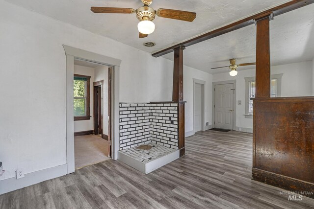 561 3rd Ave N, Twin Falls, ID 83301 - unfurnished living room featuring a ceiling fan, baseboards, and wood finished floors