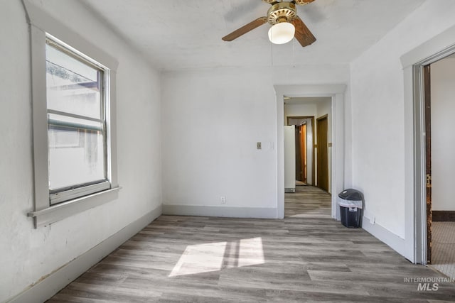 561 3rd Ave N, Twin Falls, ID 83301 - empty room featuring a ceiling fan, wood finished floors, and baseboards