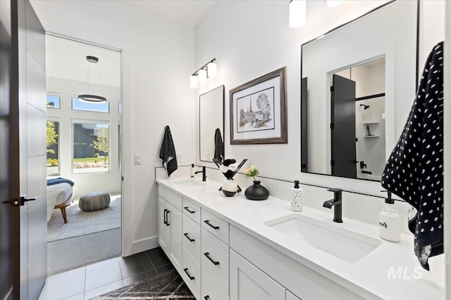 1093 N Morehouse Ave, Eagle, ID 83616 - bathroom featuring double vanity, tile patterned floors, a sink, and ensuite bathroom