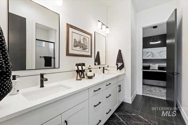 1093 N Morehouse Ave, Eagle, ID 83616 - ensuite bathroom featuring connected bathroom, double vanity, baseboards, and a sink