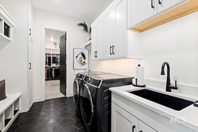 1093 N Morehouse Ave, Eagle, ID 83616 - laundry area featuring a sink, dark tile patterned flooring, independent washer and dryer, and cabinet space