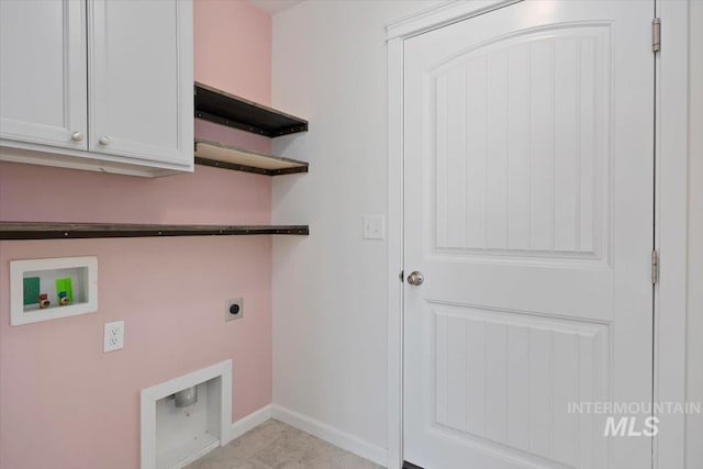 laundry area featuring electric dryer hookup, baseboards, cabinet space, and washer hookup
