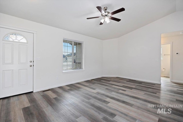 entrance foyer with baseboards, ceiling fan, wood finished floors, and lofted ceiling