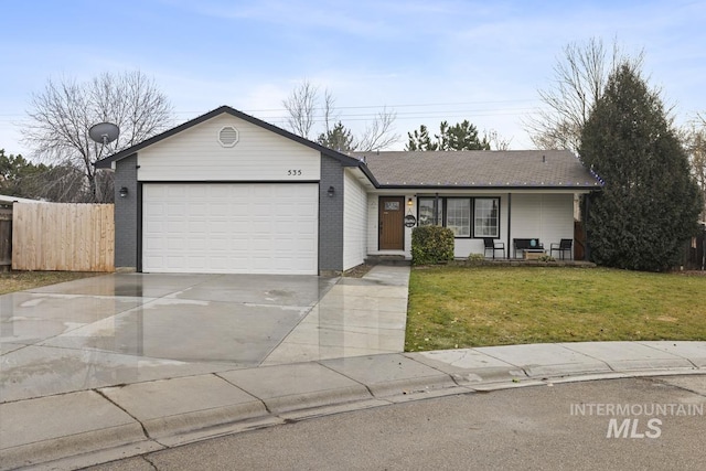 ranch-style home featuring a front yard and a garage