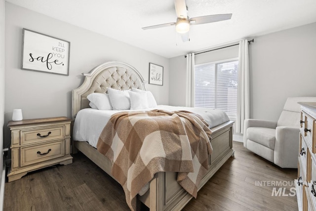 bedroom featuring ceiling fan and dark hardwood / wood-style flooring